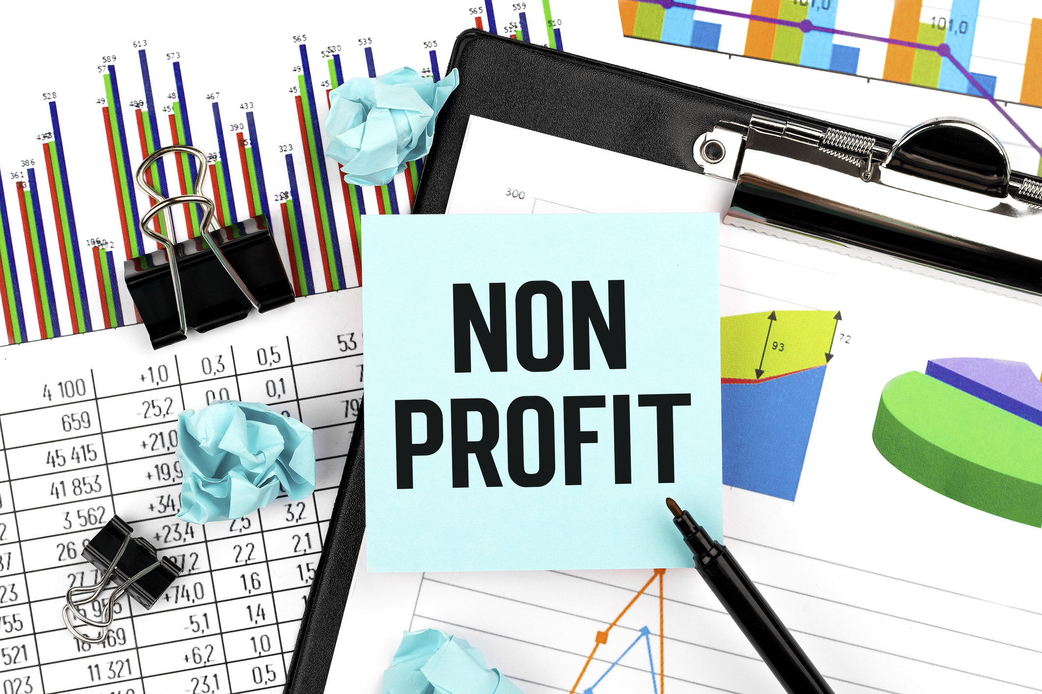 nonprofit business graphs and clipboard with paper