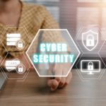 cybersecurity shield and security features by laptop