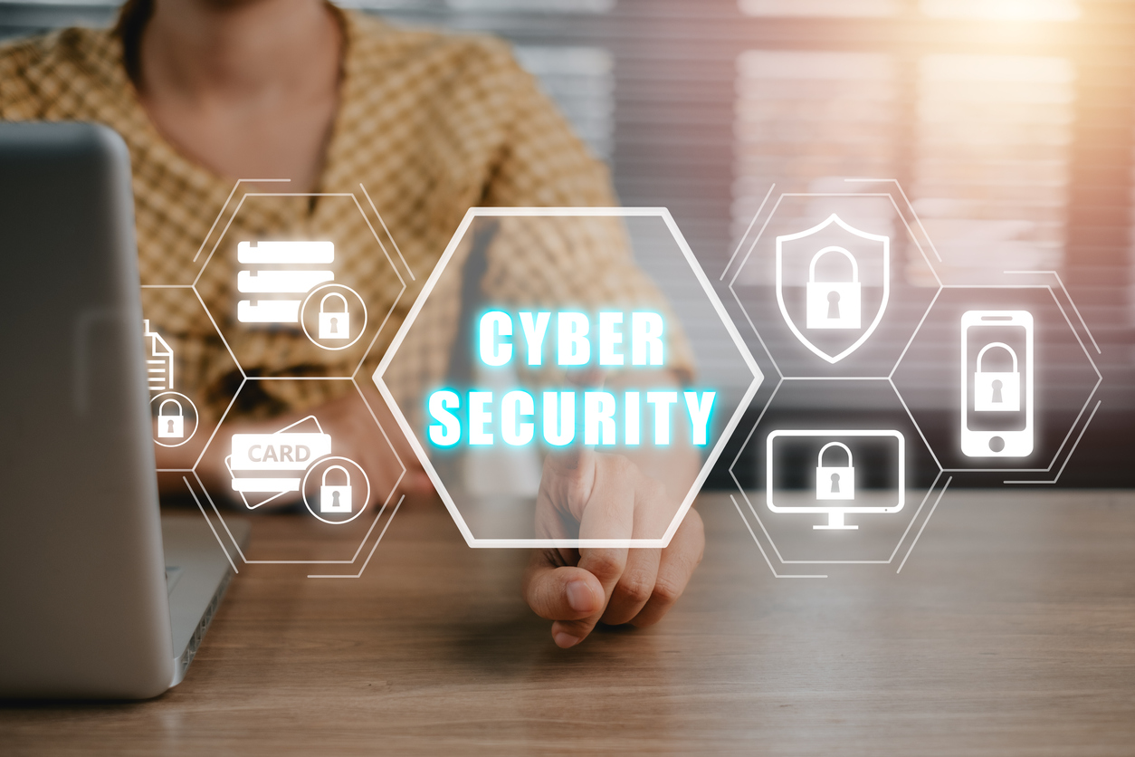 cybersecurity shield and security features by laptop