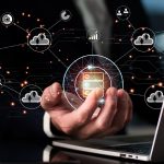 hand holding computer cloud objects over laptop transportation trucking